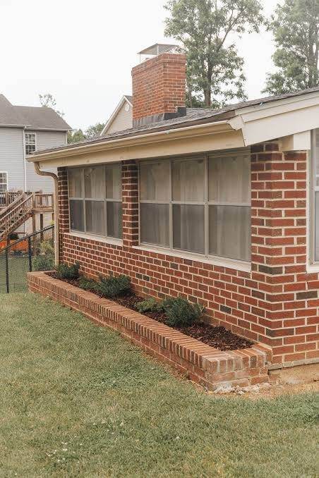 Finished red brick sunroom and chimney