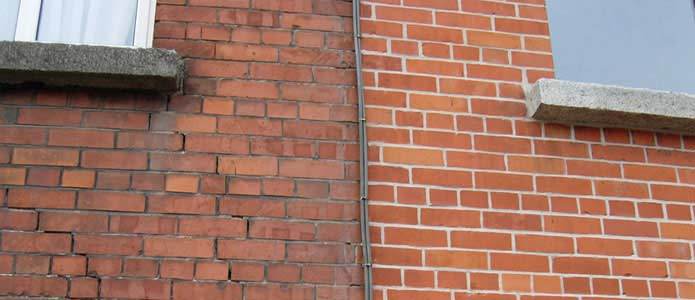 Repointed brick wall section